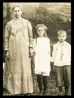Black and white photo of mother and two children